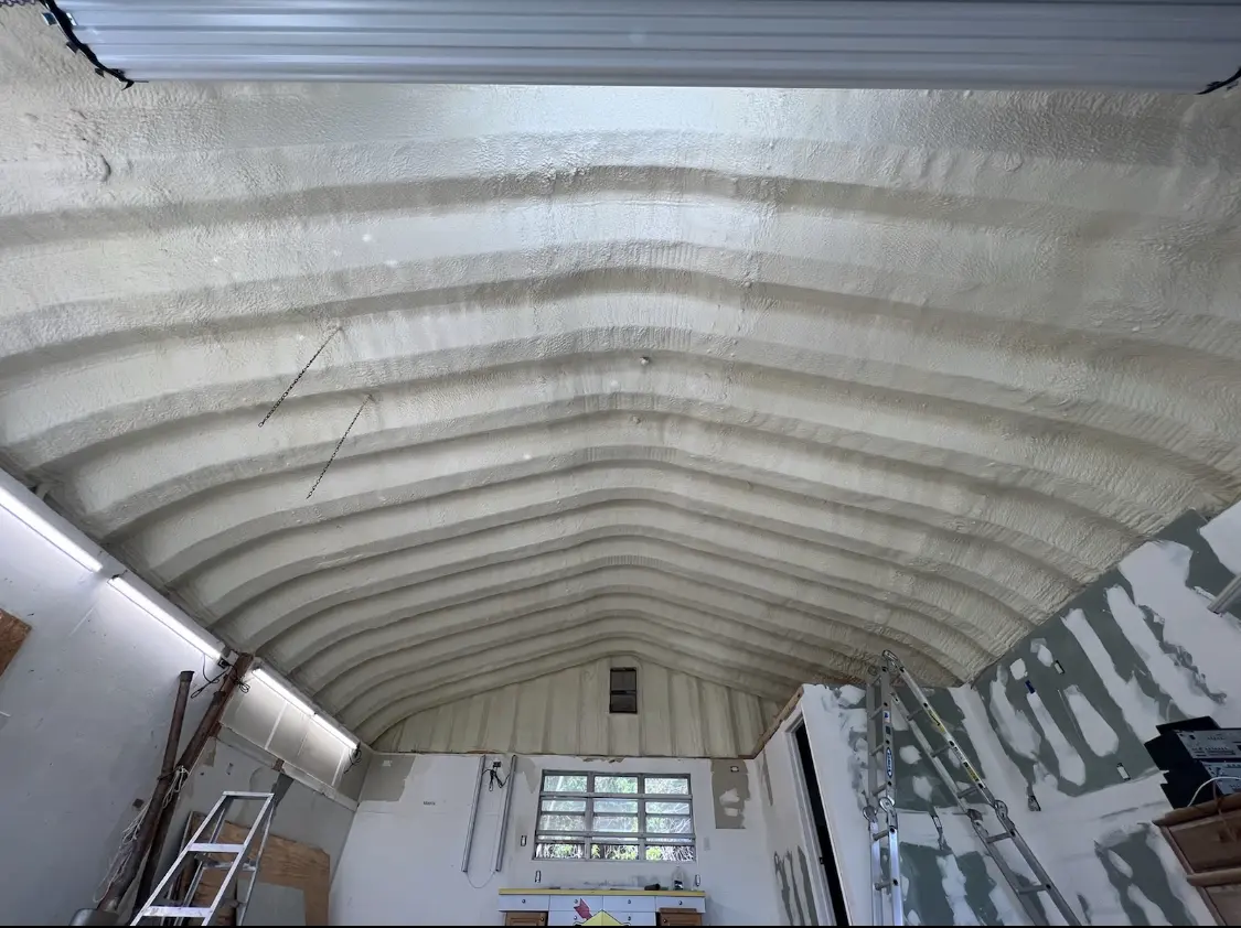 Spray polyurethane foam applied to the underside of a metal roof deck in Owego